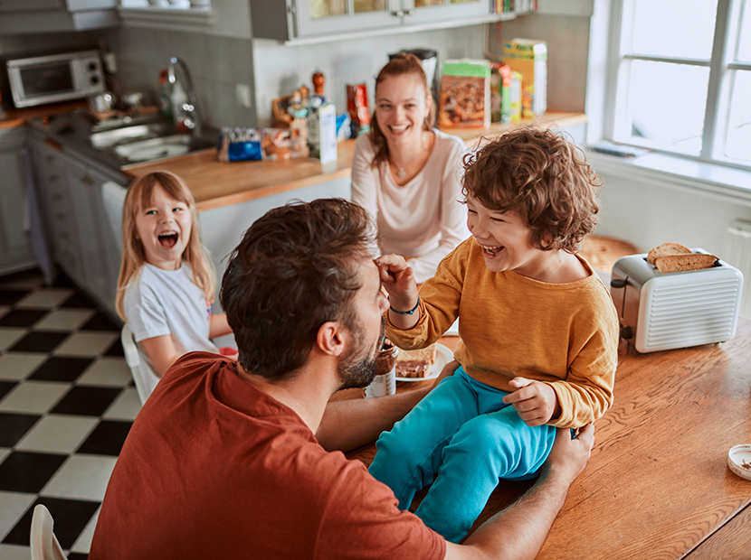 Family eating breakfast in their kitchen 